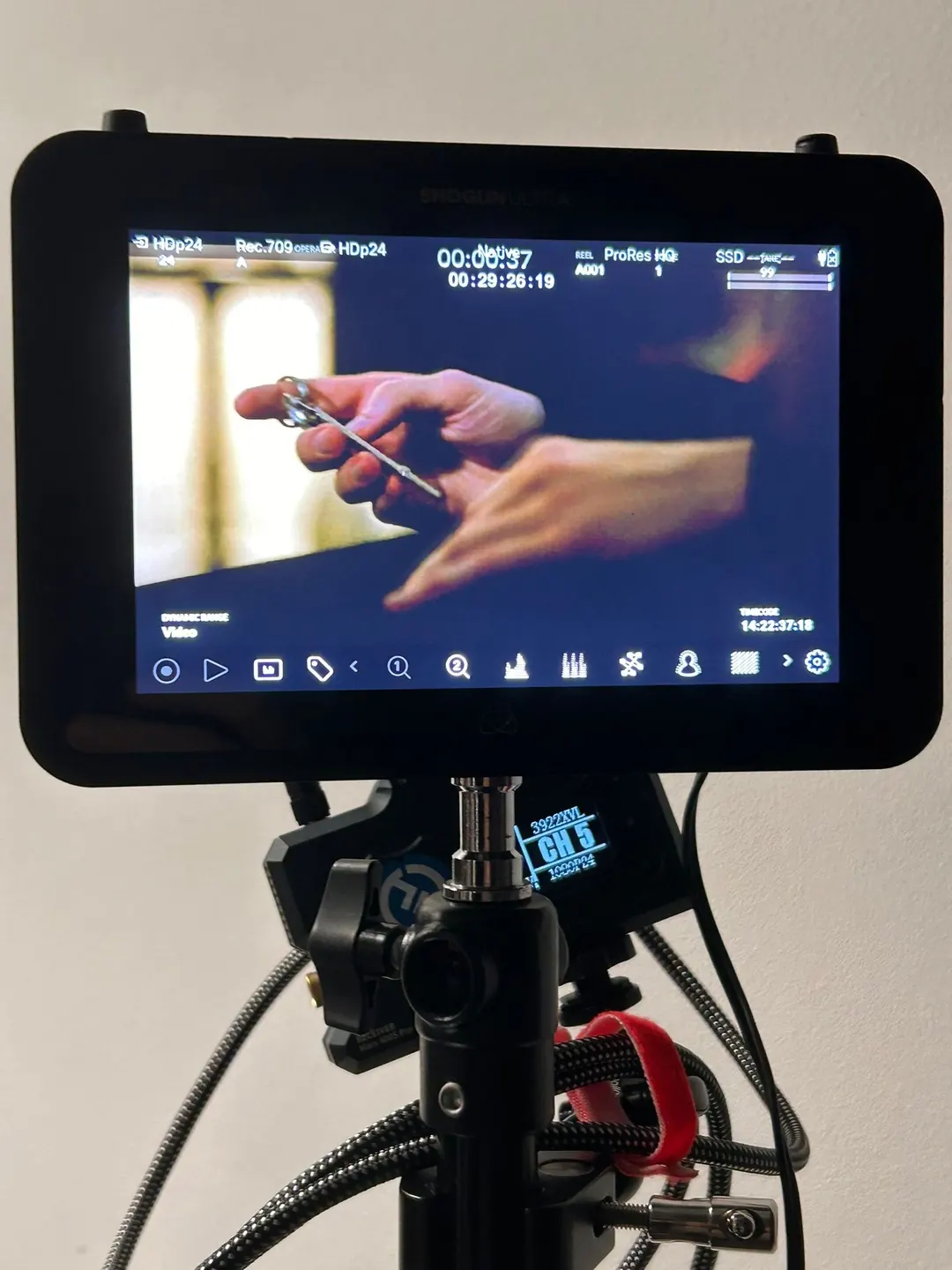 Monitor showing a close-up of hands
