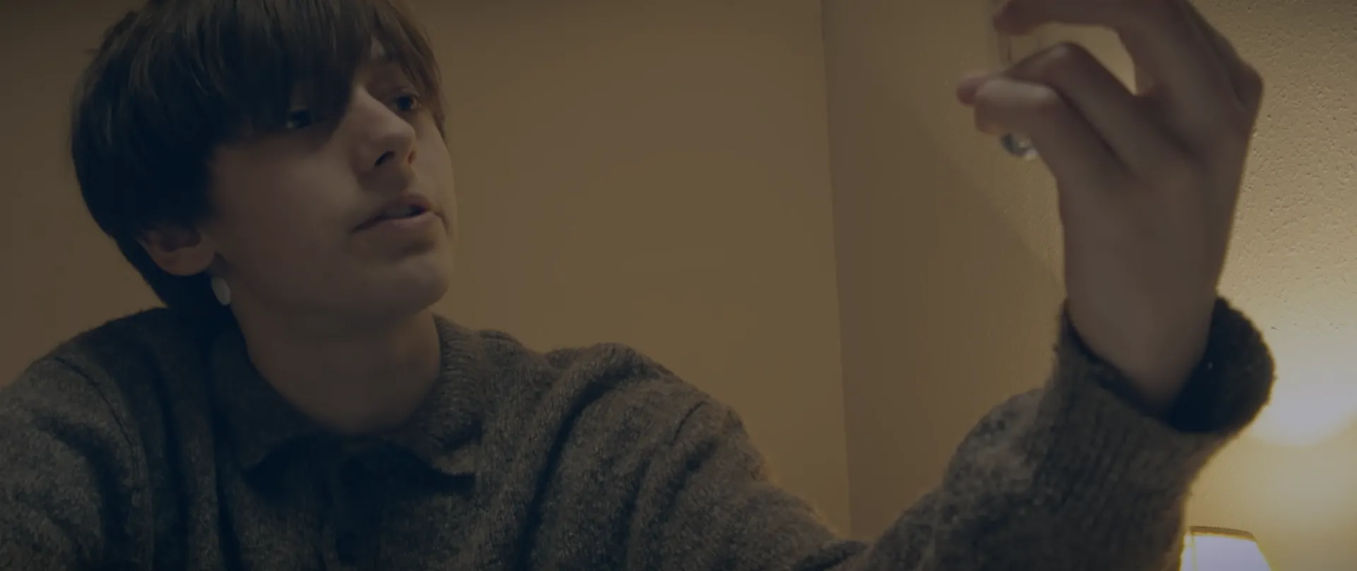 Marcus holding the fly between his fingers